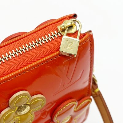 LOUIS VUITTON, a orange monogrammed vernis shoulder bag with